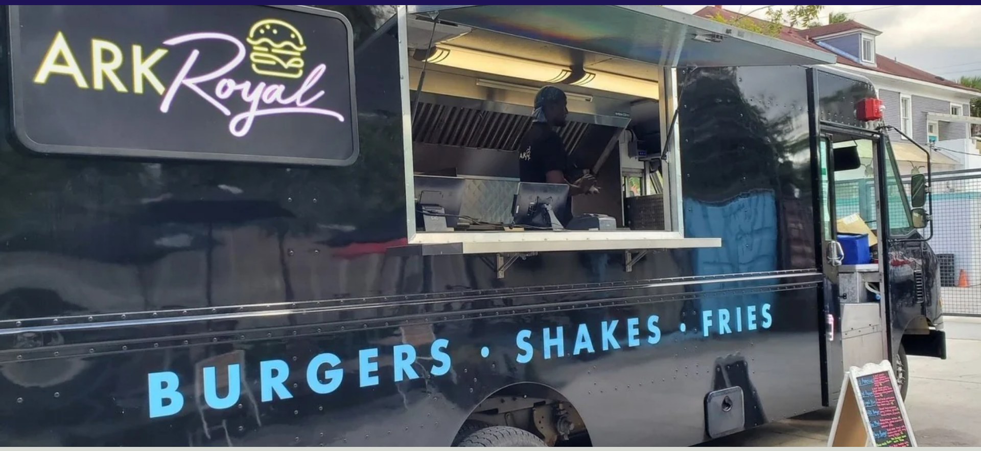 The Ark Royal food truck with its glowing neon sign